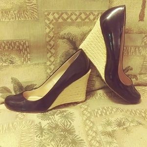 Black patent leather wedge pumps